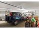 Functional garage interior with a dark-colored SUV, and organized storage solutions for convenience and efficiency at 1223 Golf Club Dr, Laughlin, NV 89029