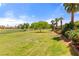 Beautiful golf course view with mature trees and manicured lawn at 1223 Golf Club Dr, Laughlin, NV 89029