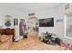 Charming living room with unique decor, including a vintage jukebox, leads into another room at 1223 Golf Club Dr, Laughlin, NV 89029