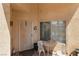 Charming outdoor seating area with a small table, two chairs, and an inviting entrance at 1223 Golf Club Dr, Laughlin, NV 89029