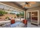 View of the backyard from covered patio with desert landscaping at 1561 Campfire Ln, Mesquite, NV 89034
