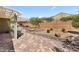 Desert landscaping accents the backyard with patio, pergola, and desert views at 1561 Campfire Ln, Mesquite, NV 89034