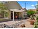 Backyard with a covered patio area, desert landscaping, desert plants, and shrubbery at 1561 Campfire Ln, Mesquite, NV 89034