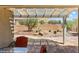 View of the backyard showing desert landscaping and pergola patio at 1561 Campfire Ln, Mesquite, NV 89034