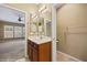 Neutral bathroom with a single sink vanity and bright lighting at 1561 Campfire Ln, Mesquite, NV 89034