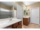 Bathroom with double sinks, tile flooring, and a walk-in shower at 1561 Campfire Ln, Mesquite, NV 89034