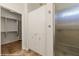 Bathroom featuring built in storage, tiled floors and a stand up shower with glass door at 1561 Campfire Ln, Mesquite, NV 89034