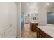 Bathroom featuring double sink vanity, tiled floors and stand up shower with glass door at 1561 Campfire Ln, Mesquite, NV 89034
