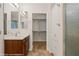 Bathroom featuring single sink vanity, built in storage and stand up shower with glass door at 1561 Campfire Ln, Mesquite, NV 89034