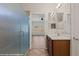 Bathroom featuring single sink vanity and a stand up shower with glass door at 1561 Campfire Ln, Mesquite, NV 89034
