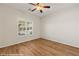 Bright bedroom with hardwood floors, ceiling fan and large window with shutters at 1561 Campfire Ln, Mesquite, NV 89034