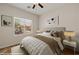 Comfortable bedroom with a queen bed, bedside tables, and natural light at 1561 Campfire Ln, Mesquite, NV 89034