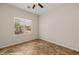 Bright bedroom with tile flooring, ceiling fan, and window view at 1561 Campfire Ln, Mesquite, NV 89034