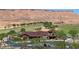 Attractive clubhouse with parking, landscaped grounds, and nearby golf course in the community at 1561 Campfire Ln, Mesquite, NV 89034