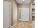 Inviting entryway with tile flooring, neutral paint, and a stylish front door with sidelight at 1561 Campfire Ln, Mesquite, NV 89034