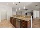 Stylish kitchen with granite island and views to living room at 1561 Campfire Ln, Mesquite, NV 89034