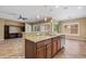 Open concept kitchen with granite countertops, stainless steel appliances, and eat-in breakfast bar at 1561 Campfire Ln, Mesquite, NV 89034