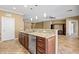 Contemporary kitchen featuring a granite island, stainless steel appliances, and custom cabinetry at 1561 Campfire Ln, Mesquite, NV 89034