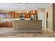 Modern kitchen featuring stainless steel appliances, an island with granite countertop, and plenty of cabinet space at 1561 Campfire Ln, Mesquite, NV 89034