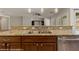 Close-up of the kitchen sink, featuring granite countertops and stainless steel appliances at 1561 Campfire Ln, Mesquite, NV 89034