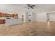 Open-concept living space with tile flooring, kitchen island, and modern appliances at 1561 Campfire Ln, Mesquite, NV 89034