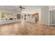 Open concept living area boasts tile floors, large windows, and adjacent kitchen at 1561 Campfire Ln, Mesquite, NV 89034