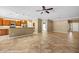 Open-concept living area with bar seating into kitchen, featuring tile flooring at 1561 Campfire Ln, Mesquite, NV 89034
