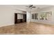 Cozy living room with custom built-ins, large windows, and tile floors at 1561 Campfire Ln, Mesquite, NV 89034