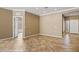 Living room features neutral walls, tile floors, and an open doorway at 1561 Campfire Ln, Mesquite, NV 89034