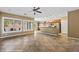 Bright living room with tile floors, recessed lighting, and windows overlooking the backyard at 1561 Campfire Ln, Mesquite, NV 89034
