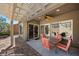 Covered patio with desert landscaped backyard and an outdoor seating area at 1561 Campfire Ln, Mesquite, NV 89034
