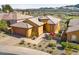 Aerial view of a single-Gathering home with desert landscaping, a two car garage, and a tile roof at 16 Cerchio Basso, Henderson, NV 89011