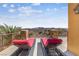 Outdoor lounge area with lounge chairs overlooking a scenic desert and mountain view at 16 Cerchio Basso, Henderson, NV 89011