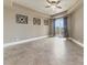 Large bedroom with tile flooring, modern fan, recessed ceiling, balcony access at 16 Cerchio Basso, Henderson, NV 89011