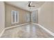 Bedroom with plantation shutters, neutral color scheme and ceiling fan at 16 Cerchio Basso, Henderson, NV 89011