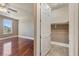 Spacious bedroom featuring hardwood floors, a ceiling fan, and a bright window with views at 16 Cerchio Basso, Henderson, NV 89011