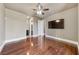 Bright bedroom with hardwood floors and sleek modern television for ultimate relaxation at 16 Cerchio Basso, Henderson, NV 89011
