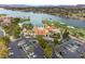 Aerial view of the clubhouse with parking, golf course and lake nearby, in a Primary-planned community at 16 Cerchio Basso, Henderson, NV 89011