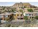 Beautiful multi-story home with stone accents and outdoor living spaces in a golf community at 16 Cerchio Basso, Henderson, NV 89011