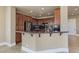 Kitchen featuring dark wood cabinets, granite countertops, and stainless steel appliances at 16 Cerchio Basso, Henderson, NV 89011
