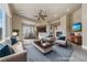 Open-concept living room connected to dining area and kitchen, perfect for entertaining at 16 Cerchio Basso, Henderson, NV 89011