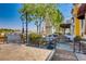 Outdoor dining area at Mimi & Coco Bistro with water view at 16 Cerchio Basso, Henderson, NV 89011