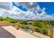 Balcony overlooking lush greenery, neighborhood homes, and a pristine swimming pool at 17 Stonemark Dr, Henderson, NV 89052