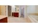 The bathroom features dual vanities, a walk-in shower, and a separate soaking tub at 17 Stonemark Dr, Henderson, NV 89052
