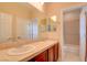 Bright bathroom with a double sink vanity, large mirror, and separate toilet and shower room at 17 Stonemark Dr, Henderson, NV 89052