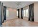 A bright bedroom featuring wood floors, recessed lighting, and natural light from shuttered windows at 17 Stonemark Dr, Henderson, NV 89052