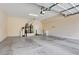 Clean, unfinished garage interior, featuring a water heater and a small desk at 17 Stonemark Dr, Henderson, NV 89052