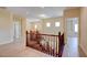 Upstairs hallway with wood floors, white walls, and recessed lighting at 17 Stonemark Dr, Henderson, NV 89052