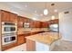 Gourmet kitchen features stainless steel appliances, granite counters, and plenty of storage at 17 Stonemark Dr, Henderson, NV 89052
