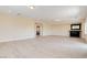 Spacious living room featuring modern light-colored floors and a bar cabinet for entertaining at 17 Stonemark Dr, Henderson, NV 89052
